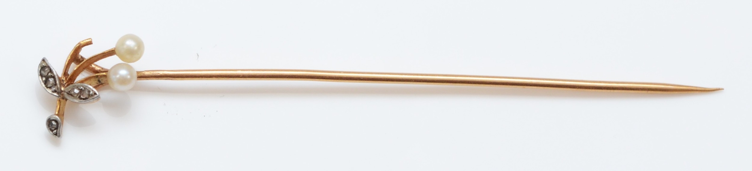 A French 18ct gold rose diamond and pearl stickpin, makers lozenge, eagles head, numbered5941, 1.9gm