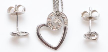 A 9ct white gold and diamond heart pendant, chain, with matching ear studs, 2.1gm