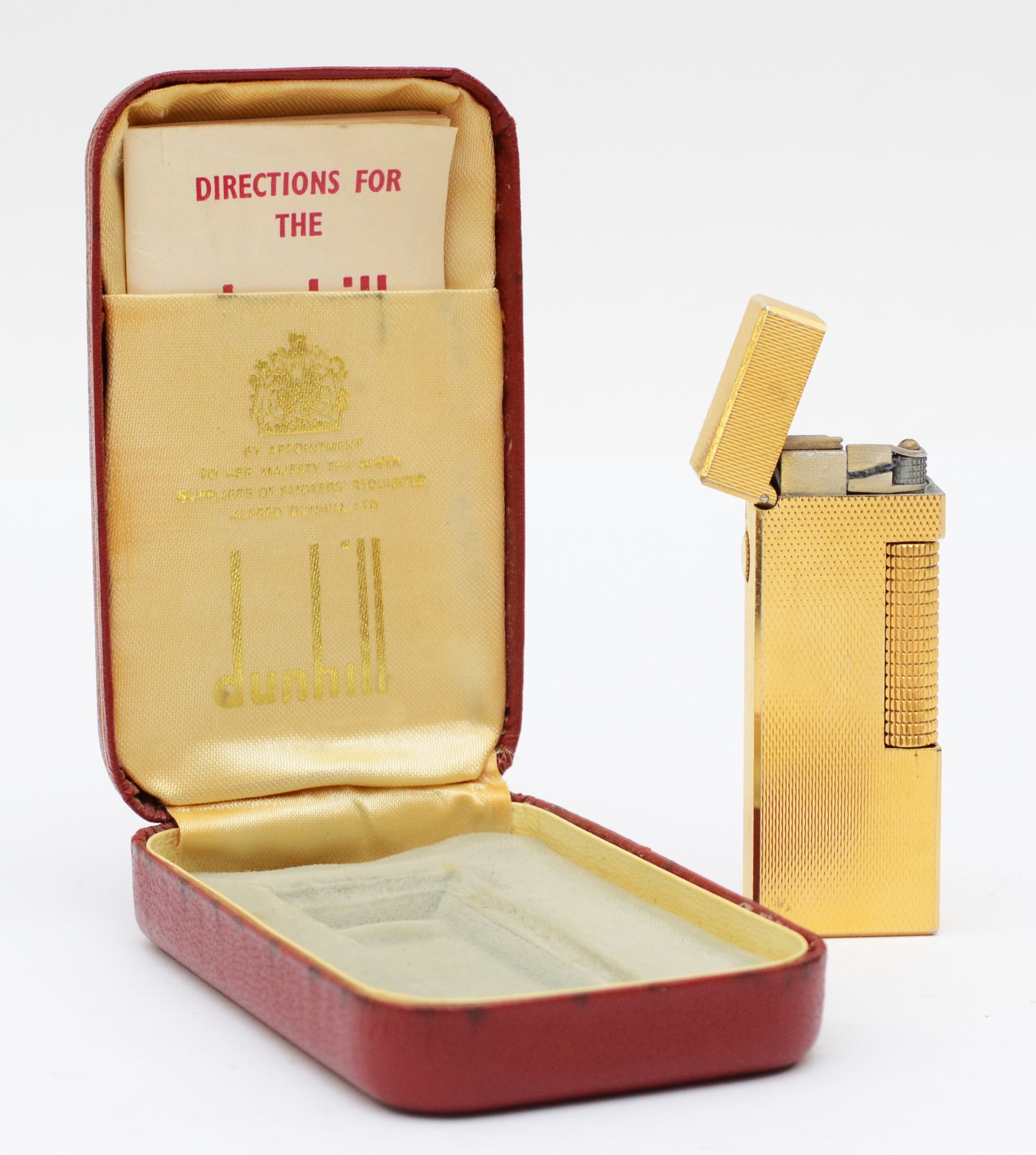 Dunhill, a gold plated Rollagas lighter, case, instructions.