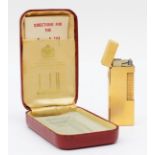 Dunhill, a gold plated Rollagas lighter, case, instructions.