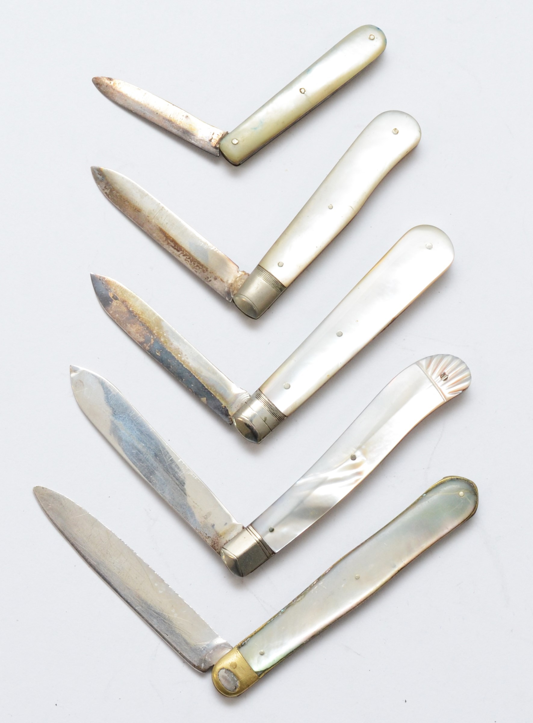 A Victorian silver and mother of pearl fruit knife, Sheffield 1881 and four other later examples. - Image 2 of 2