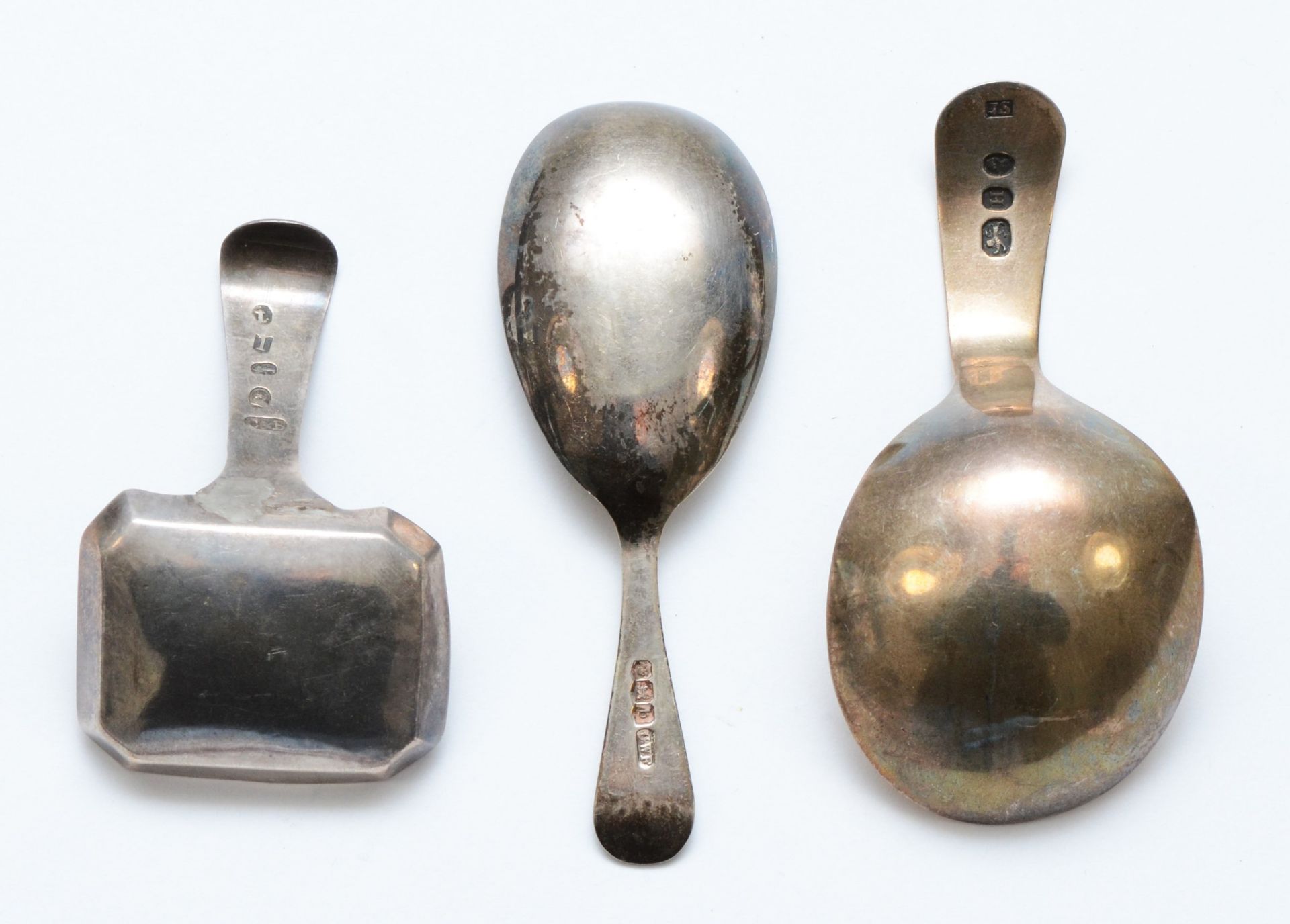 A George III silver bright cut caddy spoon, Birmingham 1809, another London 1803 and a third - Image 2 of 2