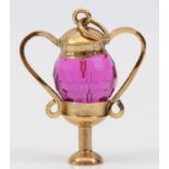 A 9ct gold and amethyst glass urn shape charm, 25mm, 4.4gm