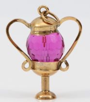 A 9ct gold and amethyst glass urn shape charm, 25mm, 4.4gm