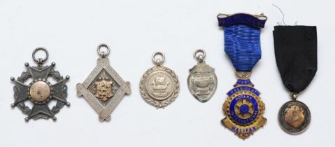 Five silver watch fobs and a silver gilt and enamel Rotary International badge, 76gms