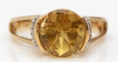 A 9ct gold citrine and diamond dress ring, O, 4.1gm