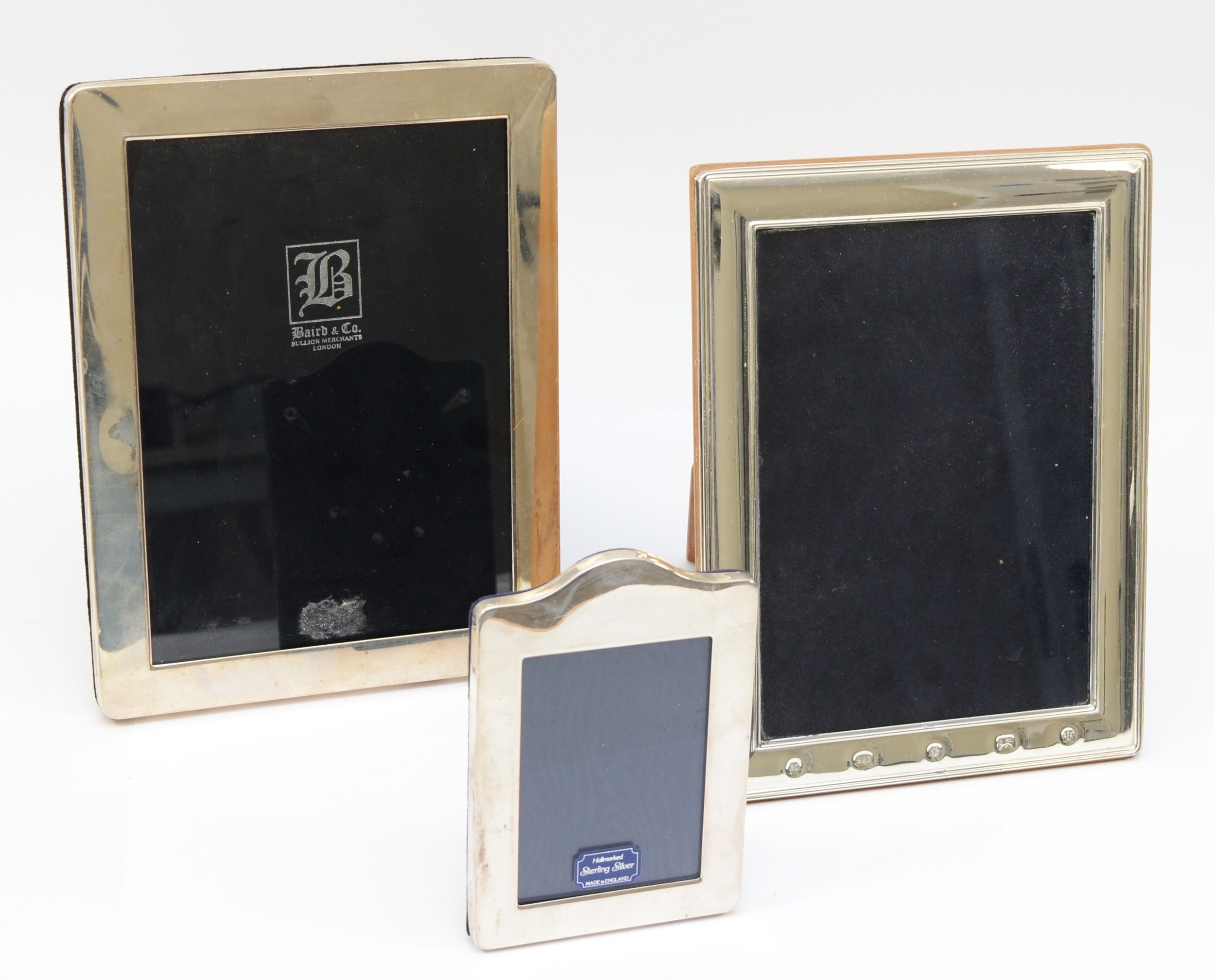 A silver photograph frame, Sheffield 2000, Millennium marks, 21 x 16cm and two other photograph