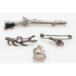 A Victorian unmarked silver and bloodstone musket brooch, 9cm, two silver and amethyst animal