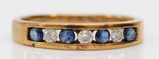 A 9ct gold sapphire and brilliant cut diamond seven stone ring, K, 1.8gm