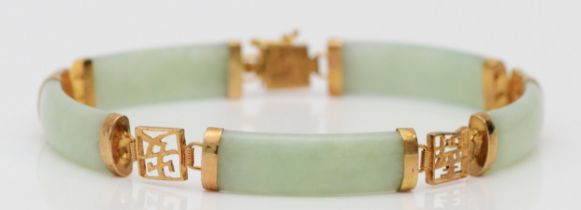 A 9ct gold mounted jadeite panel link bracelet 19cm, 8mm wide.