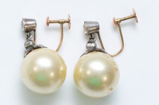 A vintage pair of 9ct gold and silver imitation 9mm pearl and paste ear rings.