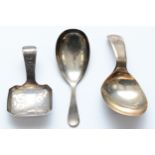 A George III silver bright cut caddy spoon, Birmingham 1809, another London 1803 and a third