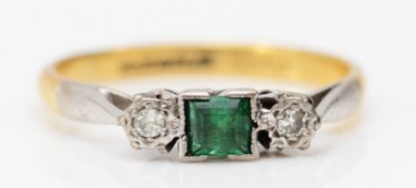 An 18ct gold emerald and diamond three stone ring, L, 2.5gm