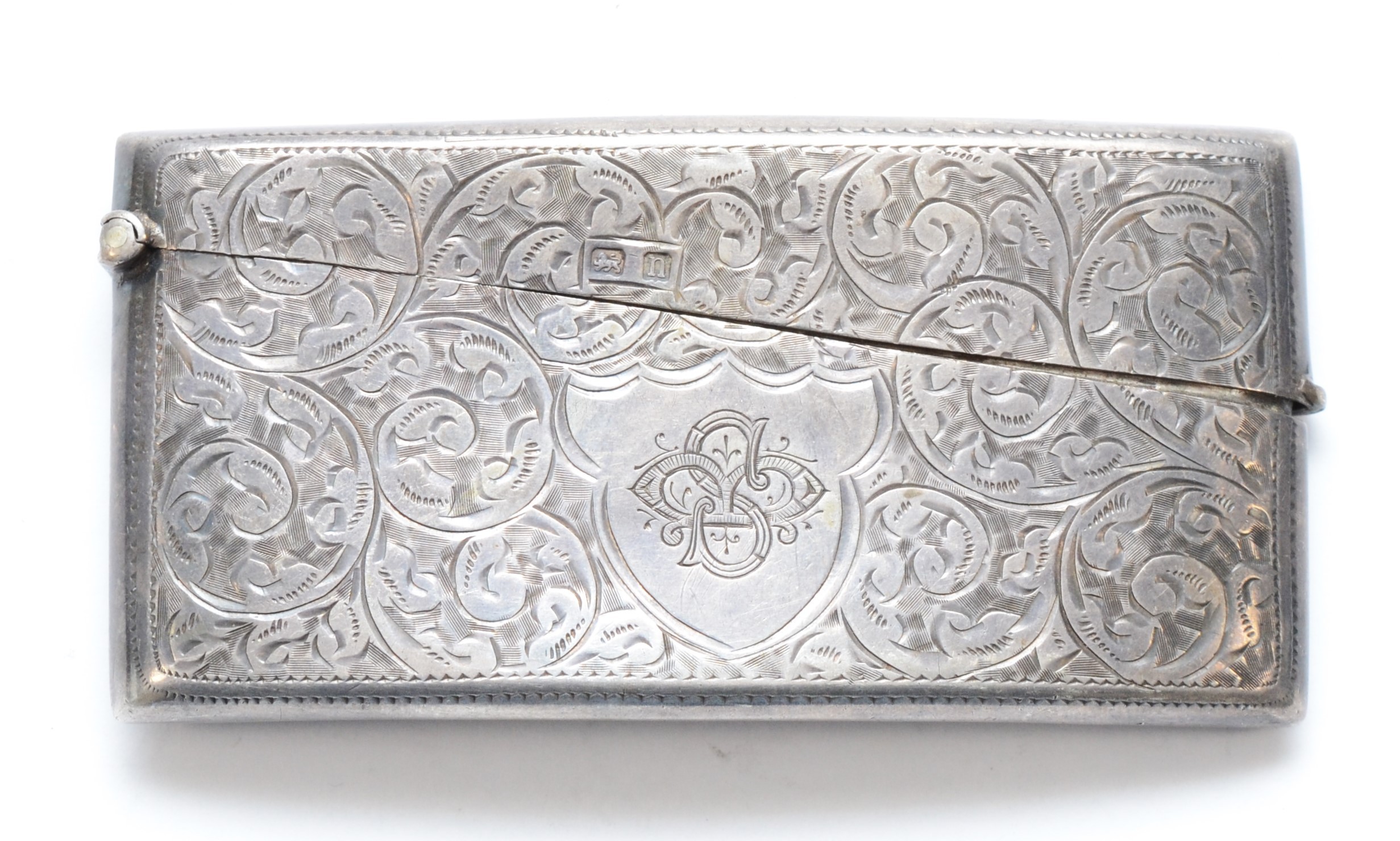 An arched silver card case, Birmingham 19128 x 4cm, 39gms.