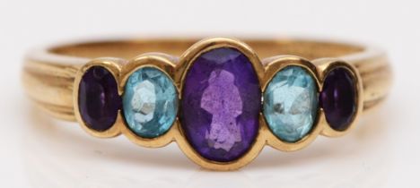 A 9ct gold amethyst and topaz five stone ring, M, 2.1gm
