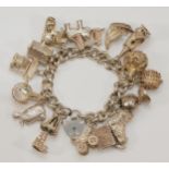 A heavy silver charm bracelet, 107gm