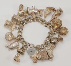 A heavy silver charm bracelet, 107gm