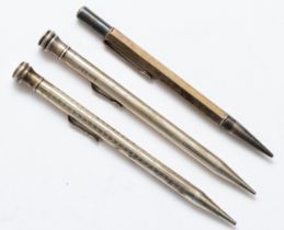 Two Eversharp silver propelling pencils and another silver pencil.
