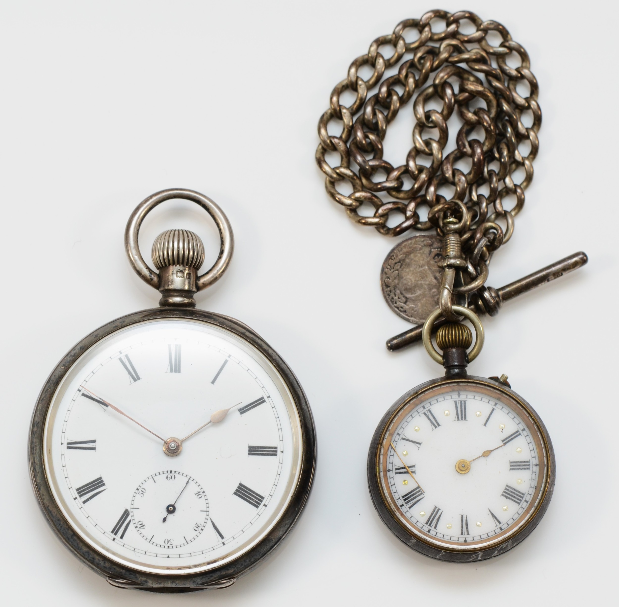 A silver keyless wind open face pocket watch, Birmingham 1906, a gun metal fob watch, both spares or