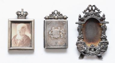 An Edwardian silver locket, Birmingham 1907, a Victorian silver crowned photograph frame, Chester
