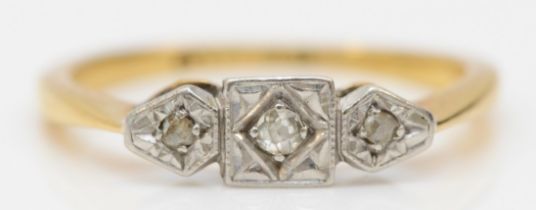 An Art Deco 18ct gold and platinum three stone diamond ring, J 1/2, 2.2gm