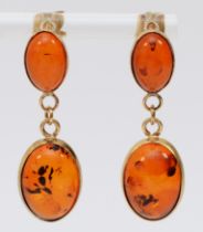 A pair of 9ct gold and amber ear pendants, 35mm, 4.4gm