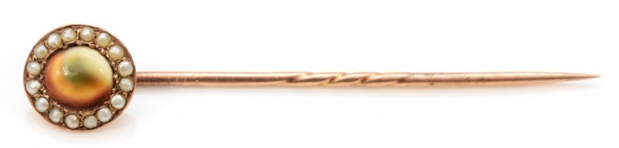 A Victorian unmarked rose gold, abolone shell and half pearl stickpin, 2gm.
