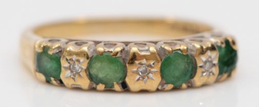 A 9ct gold emerald and diamond seven stone ring, L, 2.4gm