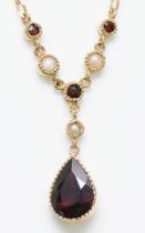 A 9ct gold garnet and cultured pearl necklace, chain, stone 10 x 7mm, 3.2gm