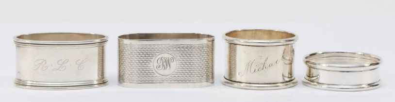 A silver napkin ring, London 1979, initialled R.L.C. and three other silver napkin rings, 89gm