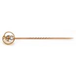 An Edwardian 9ct gold, aquamarine and half pearl stickpin, 1.2gm case