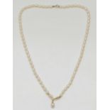 A single row cultured pearl necklace, with 9ct gold V motif, 40cm