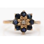 A 9ct gold sapphire and diamond cluster ring, O, 2.4gm