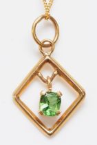 A 9ct gold and green stone pendant, 18mm, chain, 2gm