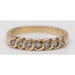 A 9ct gold and brilliant cut diamond seven stone diamond ring, stated weight 0.25cts, N, 3.3gm