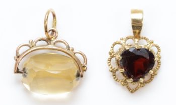 An unmarked gold garnet heart shape pendant,16mm and an unmarked gold swivel seal, 2.4gm
