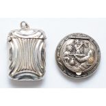 A Victorian electroplated vesta case and a circular silver pill box with Dutch sword mark.