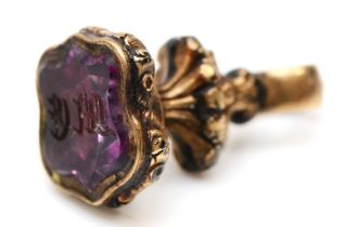 A Victorian gold cased and amethyst seal, initialled, 21mm