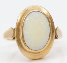 A 9ct gold and opal panel ring, stone, 14 x 9mm, R, 5.1gm, good colour play, surface abrasions,