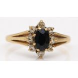 A 9ct gold sapphire and diamond cluster ring, L, 1.7gm
