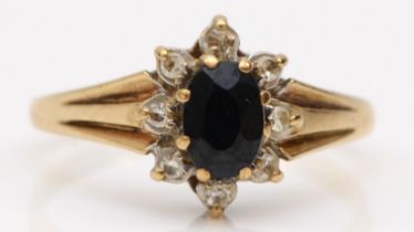 A 9ct gold sapphire and diamond cluster ring, L, 1.7gm