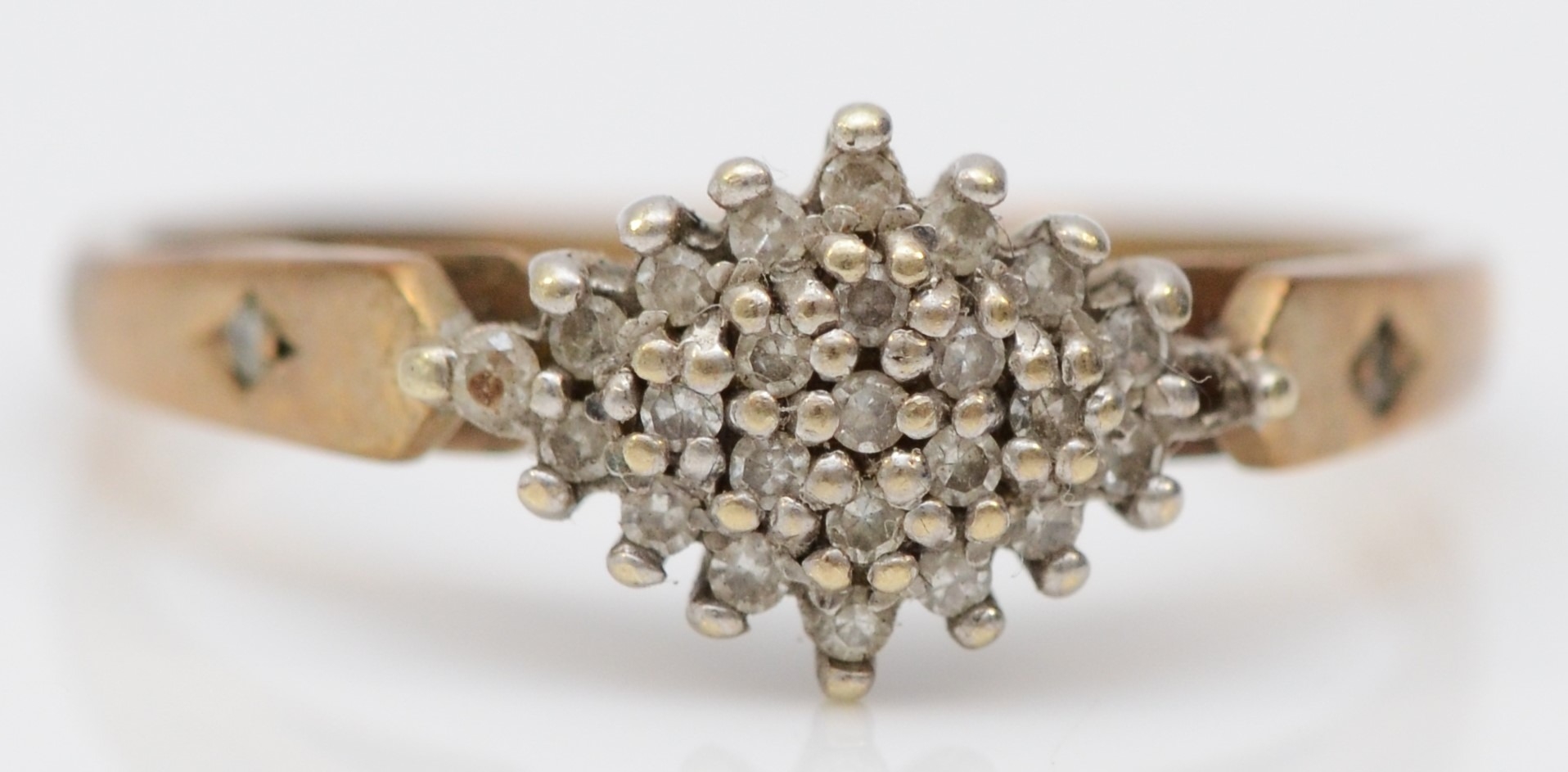 A 9ct gold and diamond cluster ring, P, 2.1gm