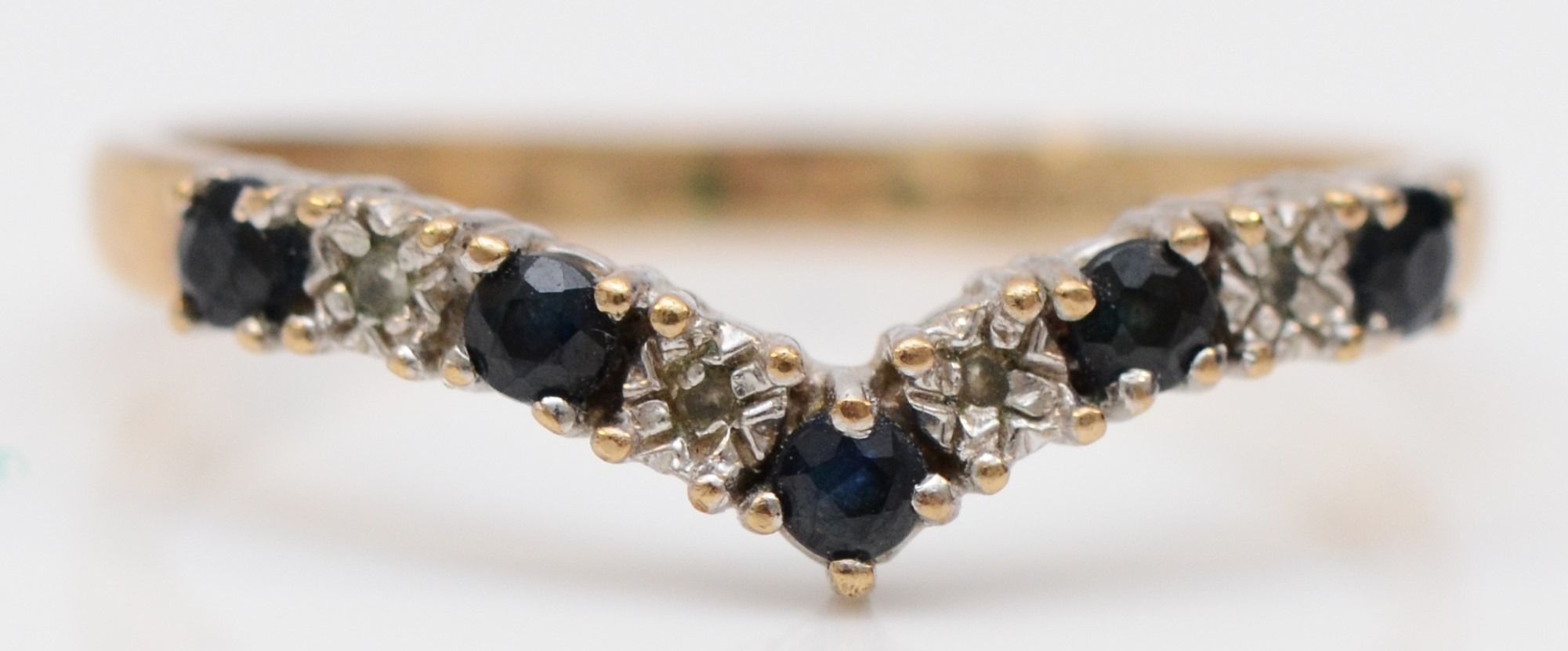 A 9ct gold sapphire and diamond chevron ring, O, 1.5gm