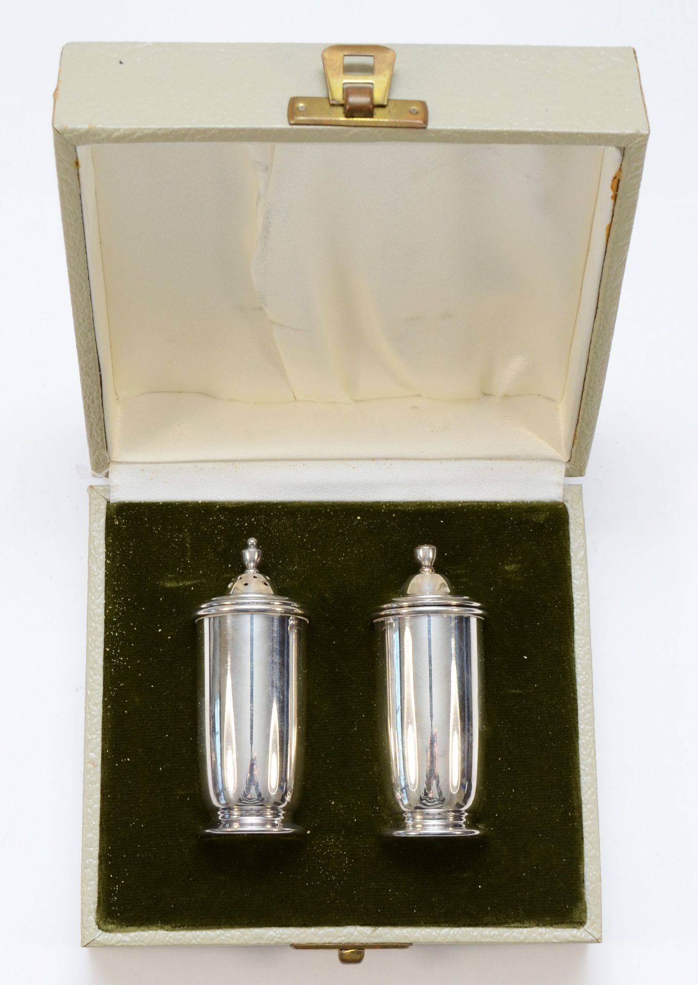 An Irish pair of salt and pepper, Dublin 1974, London import marks, 7.5cm, 67gms, case