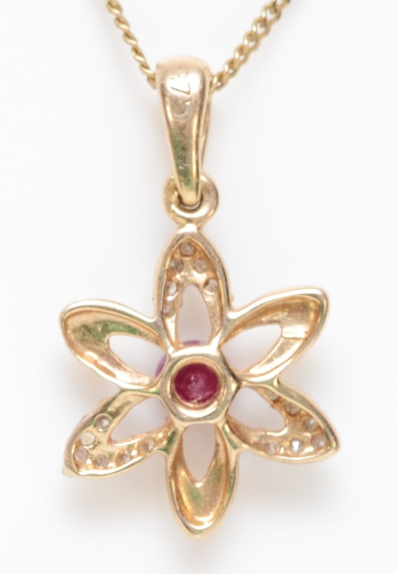 A 9ct gold ruby and diamond pendant, 1.3gm - Image 2 of 2