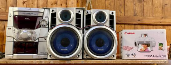 A Panasonic midi Hi-Fi system, model SA-AK210, with a pair of matching speakers, together with a