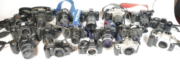 Twenty six SLR vintage film cameras to include a Pentax P30N, a Minolta 3000i, a Praktica BX20 and a