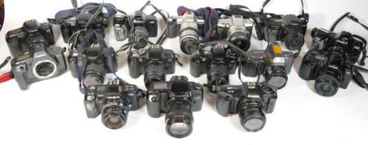 Twenty five SLR vintage film cameras to include a Minolta 3xi, a Canon EOS 5000, a Pentax MZ-5n, and