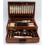 A comprehensive oak cased canteen of cutlery by Sharman D.Neill Belfast, circa mid 20th century.