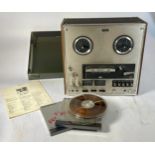 A Sony TC-645 reel to reel player with original operators manual.